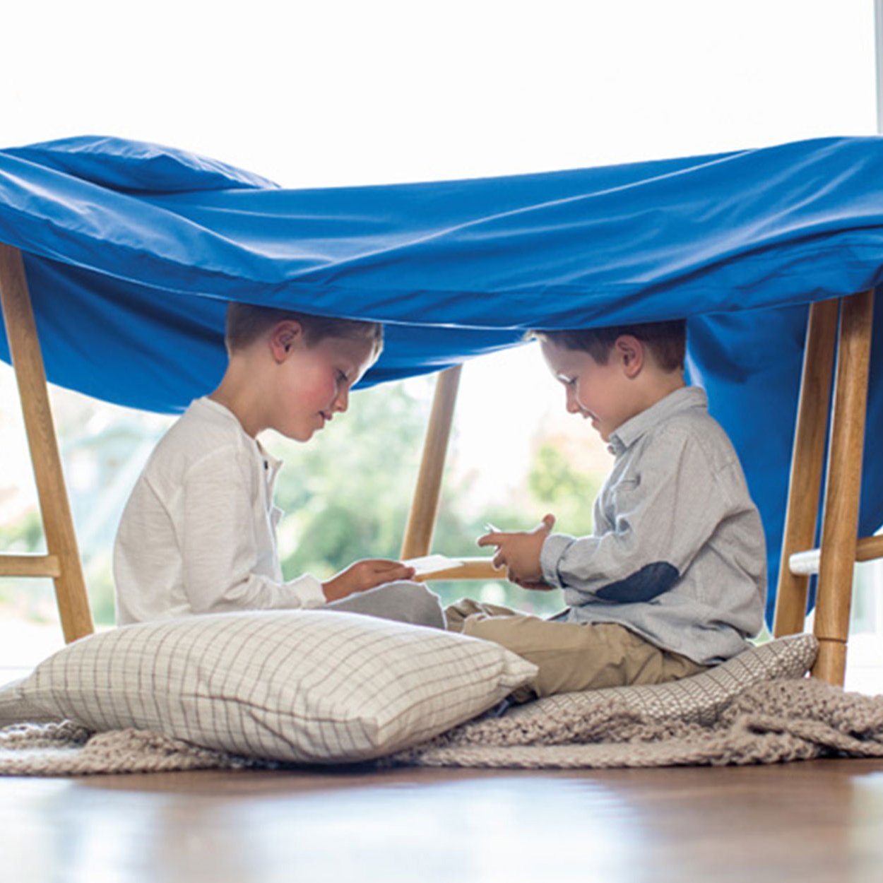 stage-boys-under-blue-sheet_sq