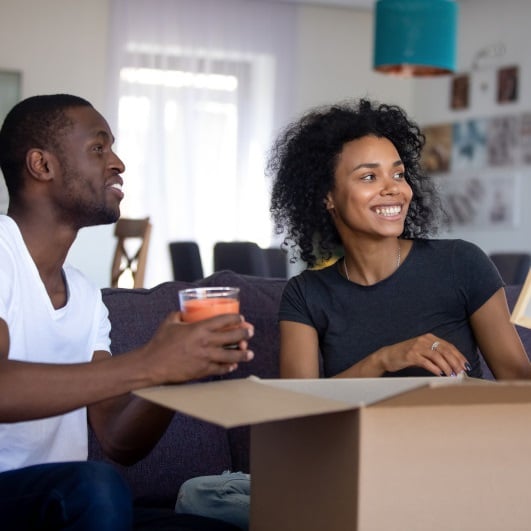 Couple unpacking on moving day