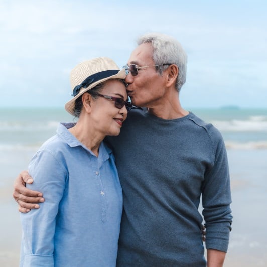 elderly couple on a beach