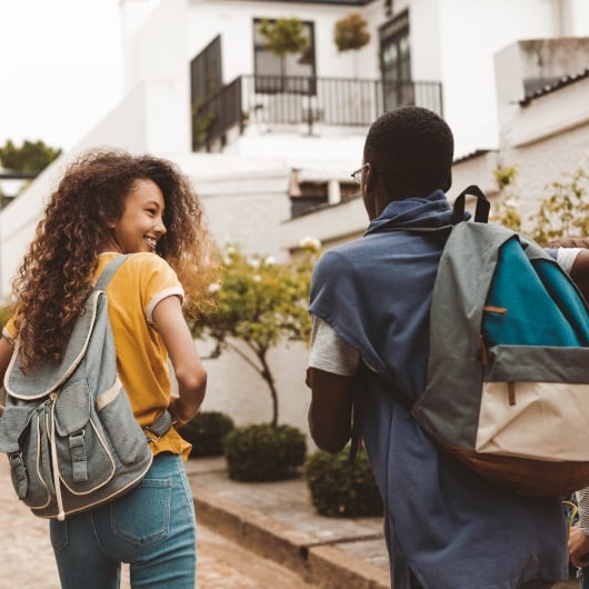 students walking to the house