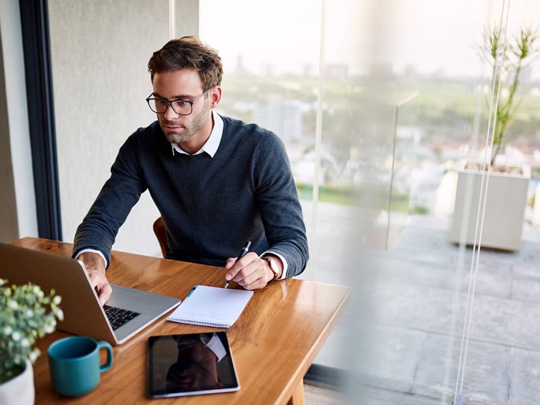 man looking at laptop