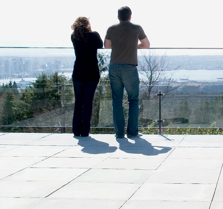 Couple standing on balcony