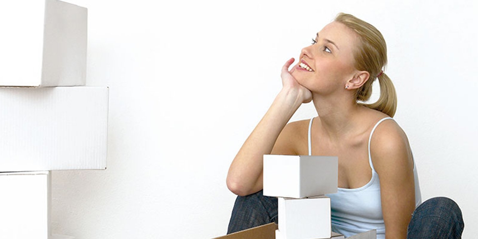 Girl looking at boxes at home