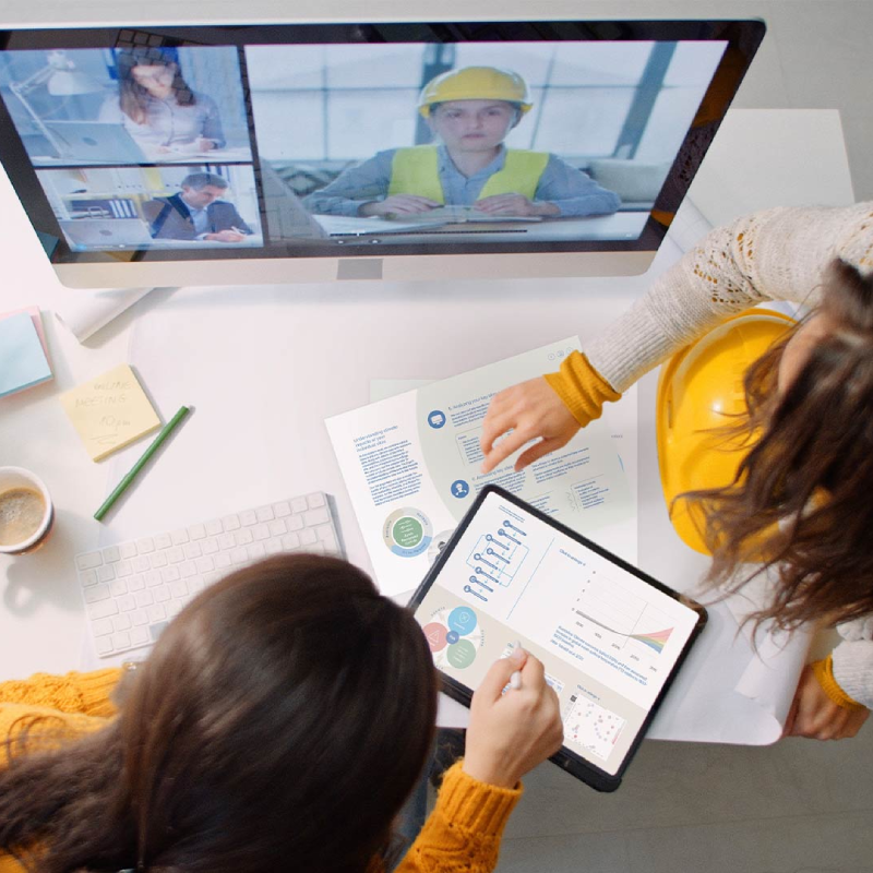 Risk Engineers discussing the risk insights on a work desk