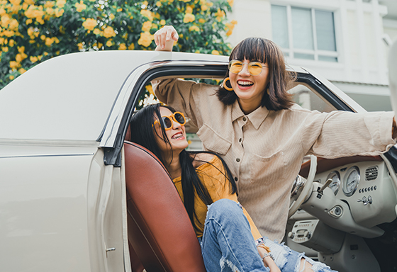 Two girls are enjoying their road trip