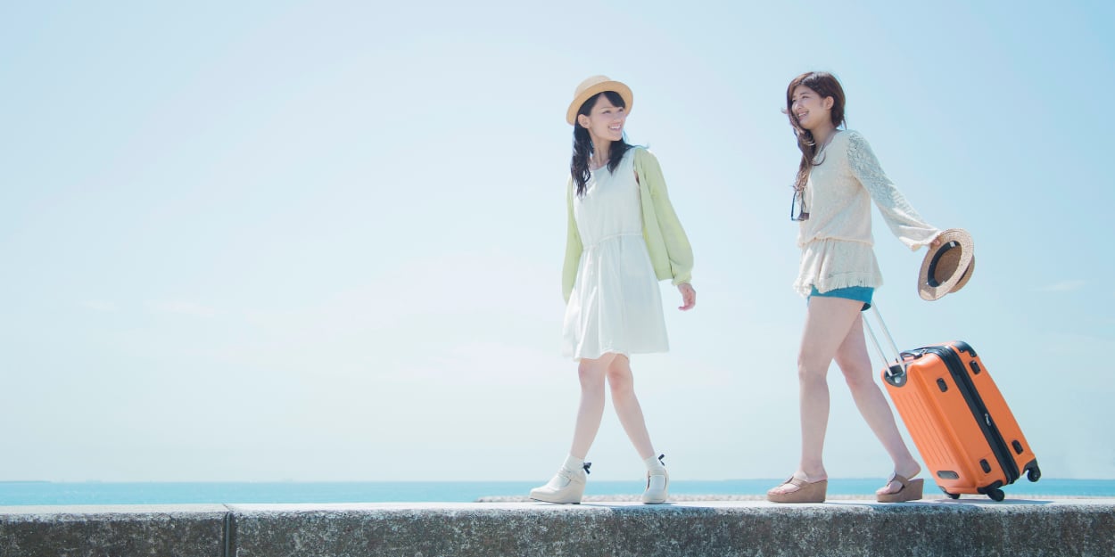 Two girls on vacation by the sea