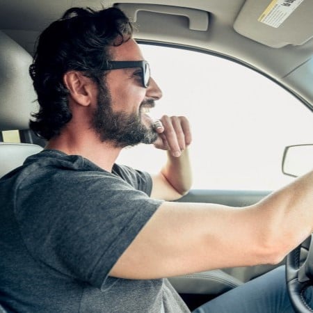 A person dring a car
