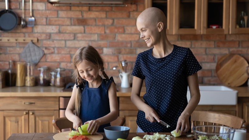 A critical ill patient and her child preparing food 