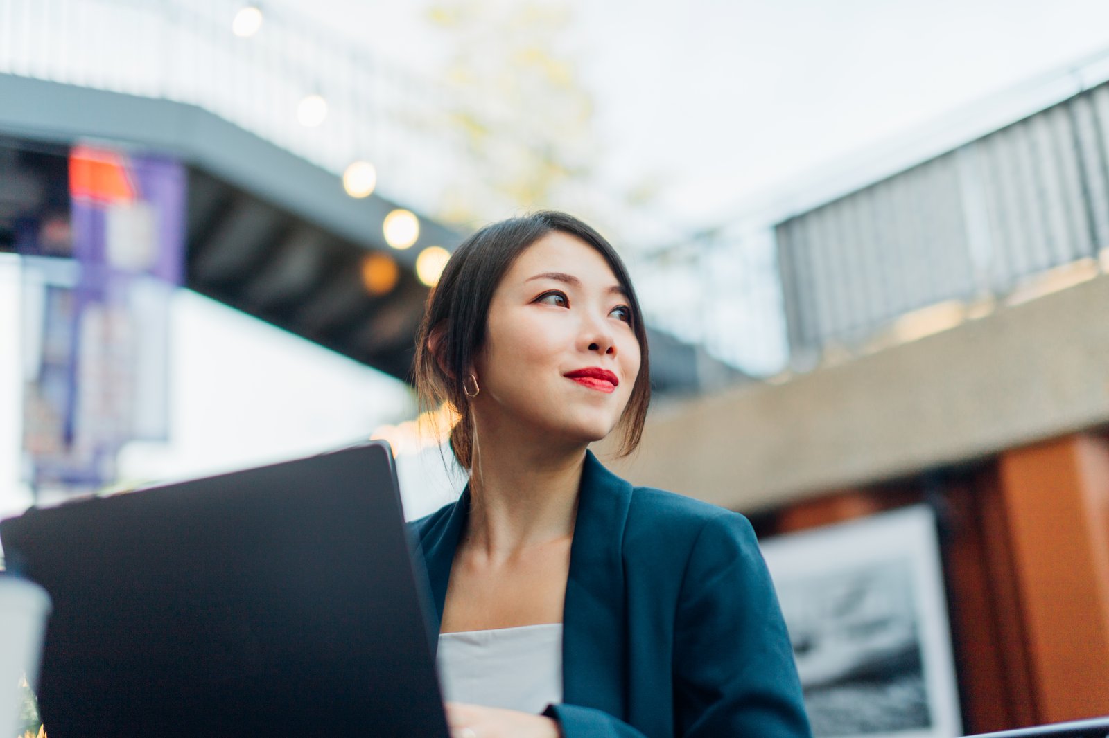 Women with laptop looking up