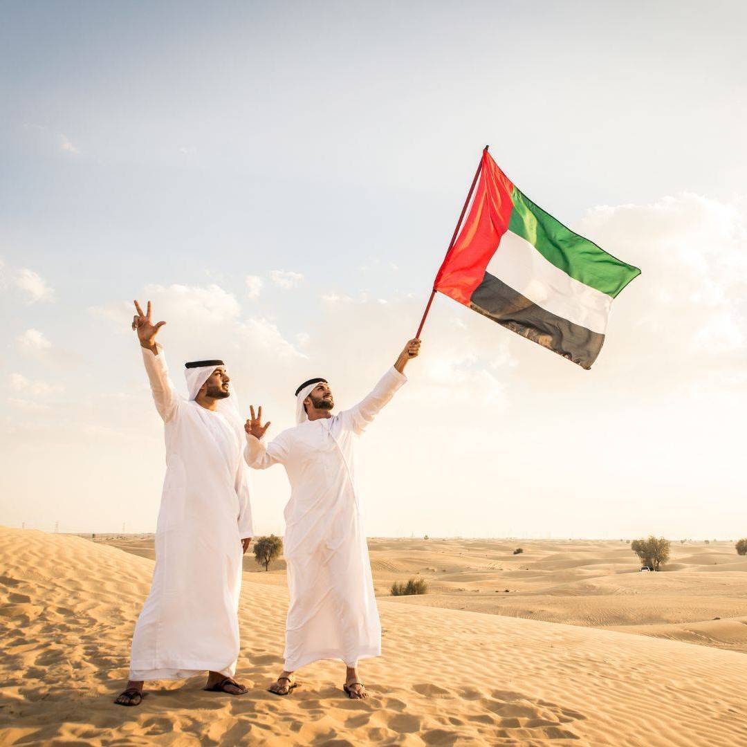 two men waving a flag