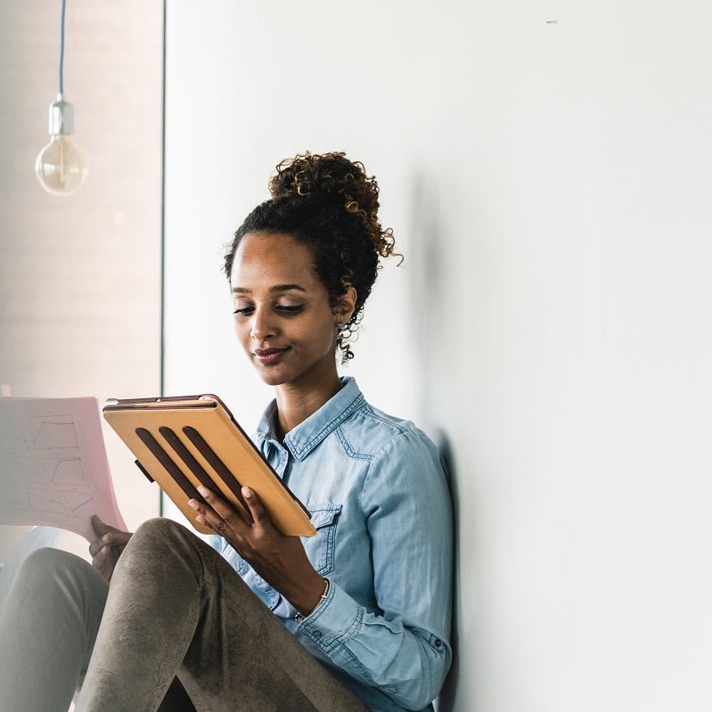 Woman reading from the tablet