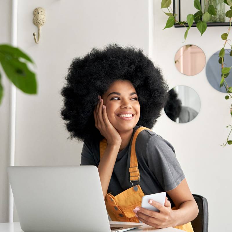 Woman on computer smiling