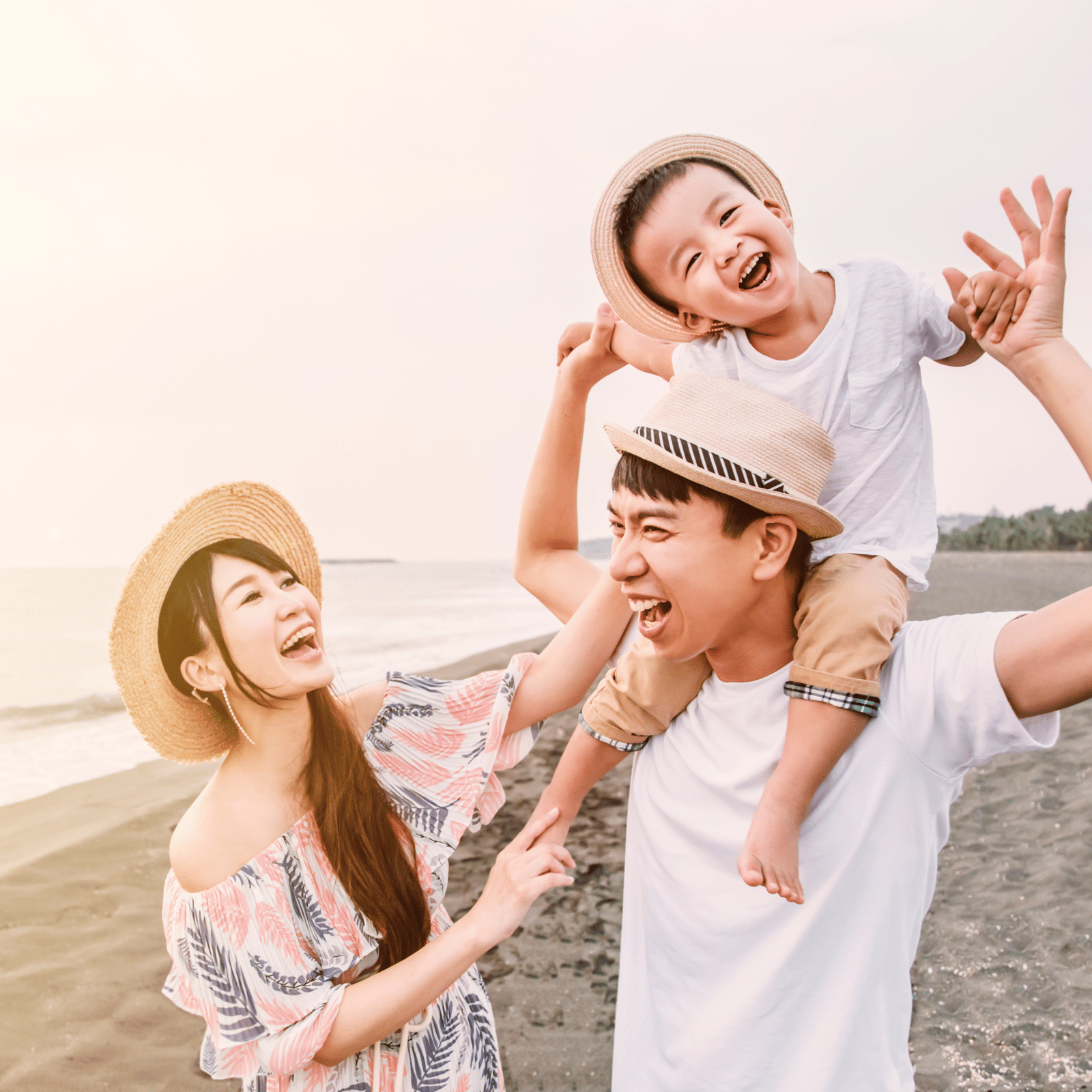 Asian family traveling at beach location