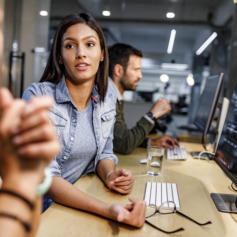 Woman talking to a colleague