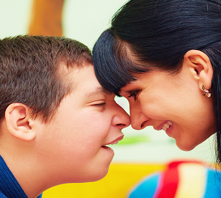 Blurred image of boy with mum
