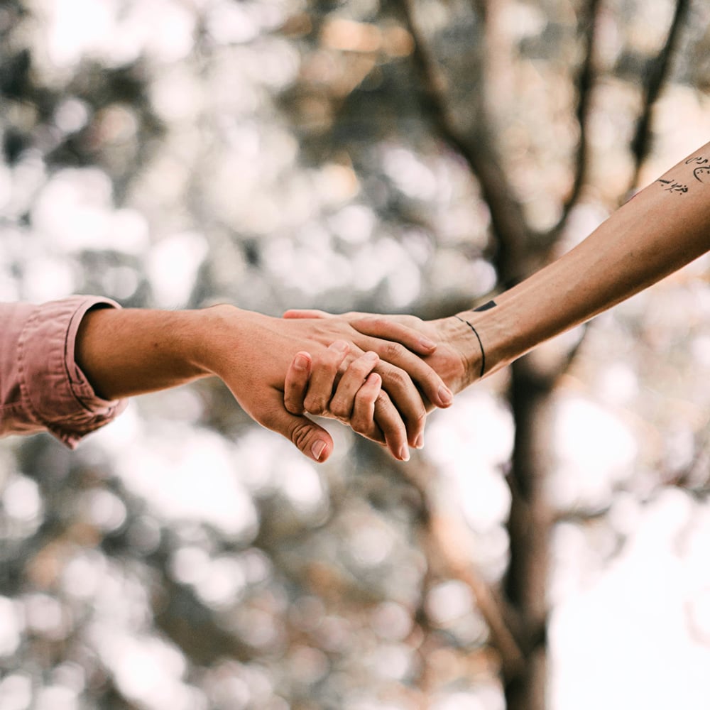 Two People Holding Hands