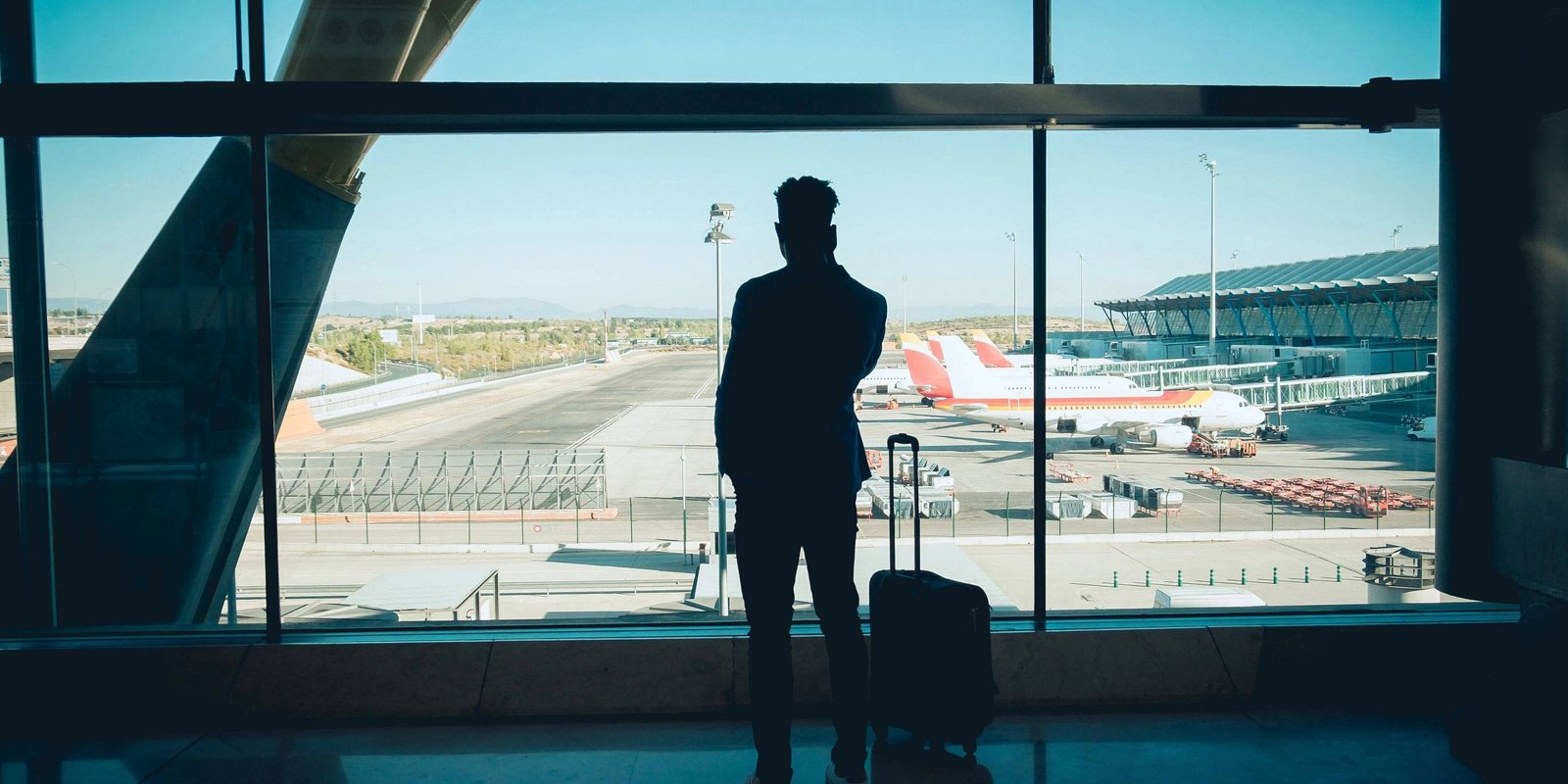 Businessman talking on the phone while waiting at the airport