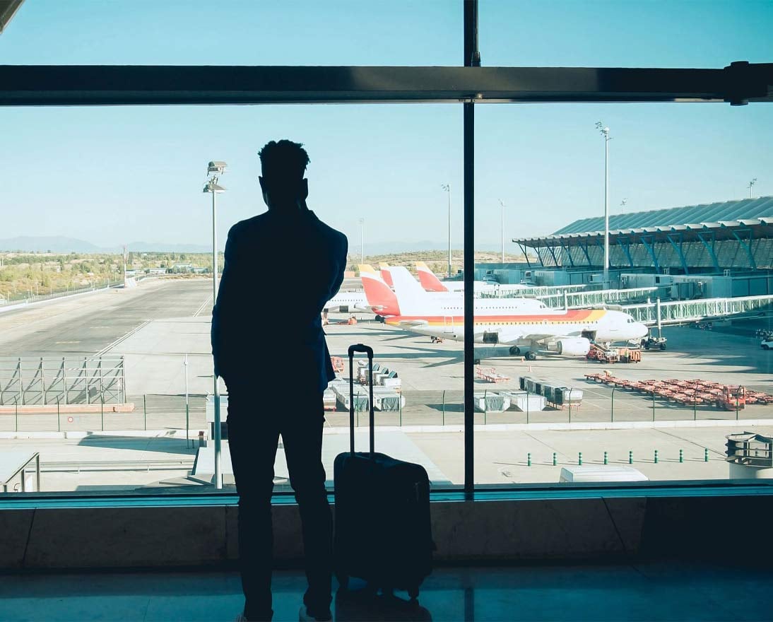 Businessman talking on the phone while waiting at the airport