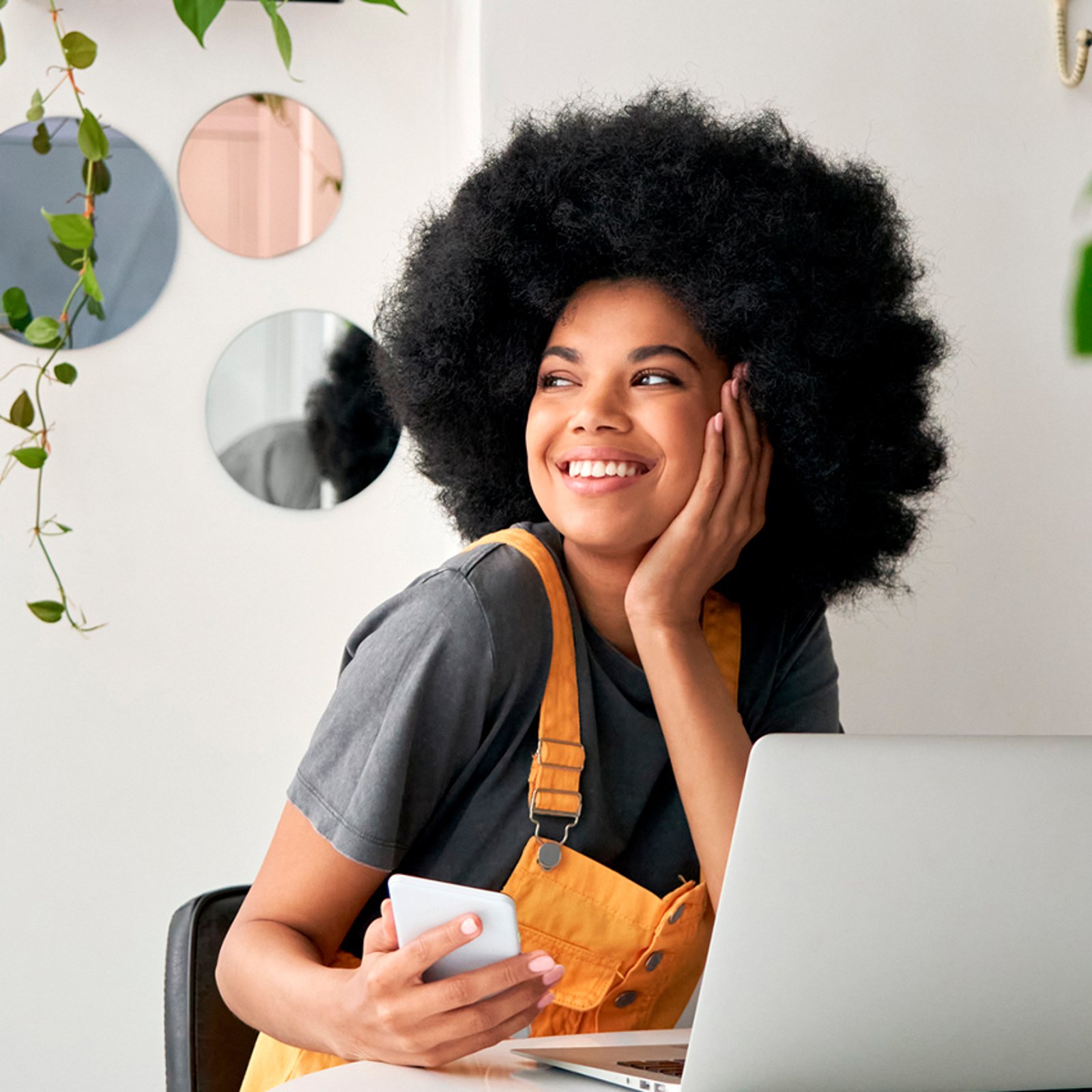 Woman smiling holding phone