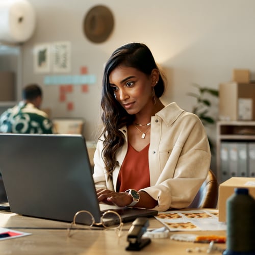 woman working on computer in public 