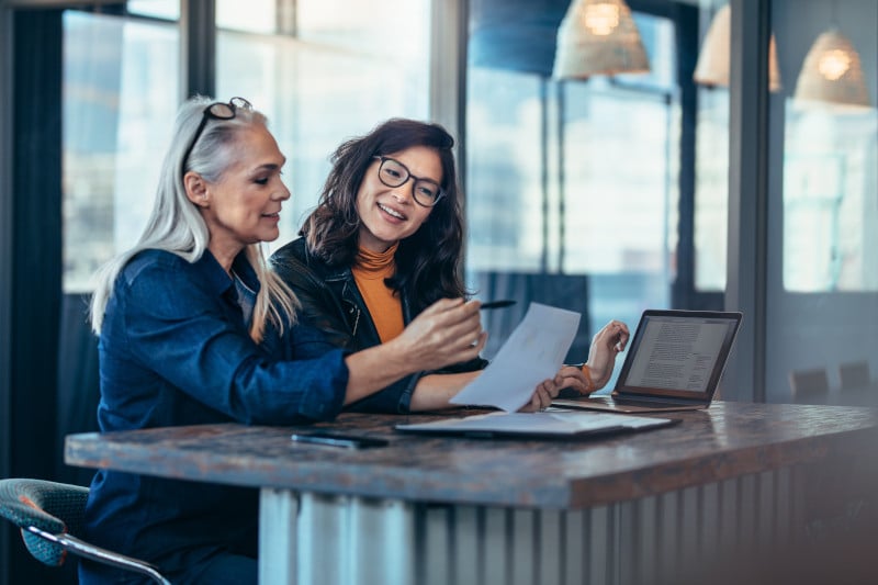 two women talking through a climate assessment