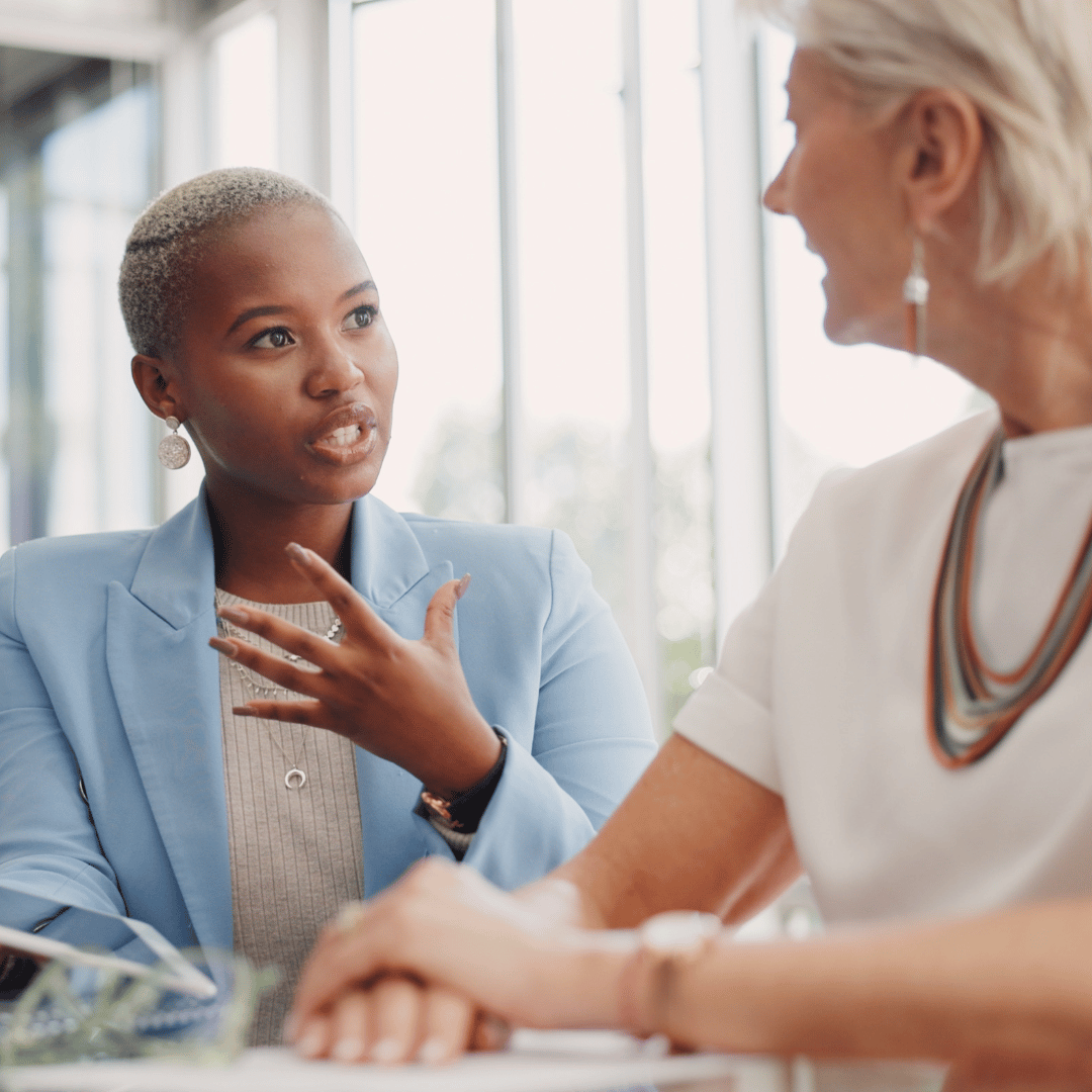 two women talking about property values