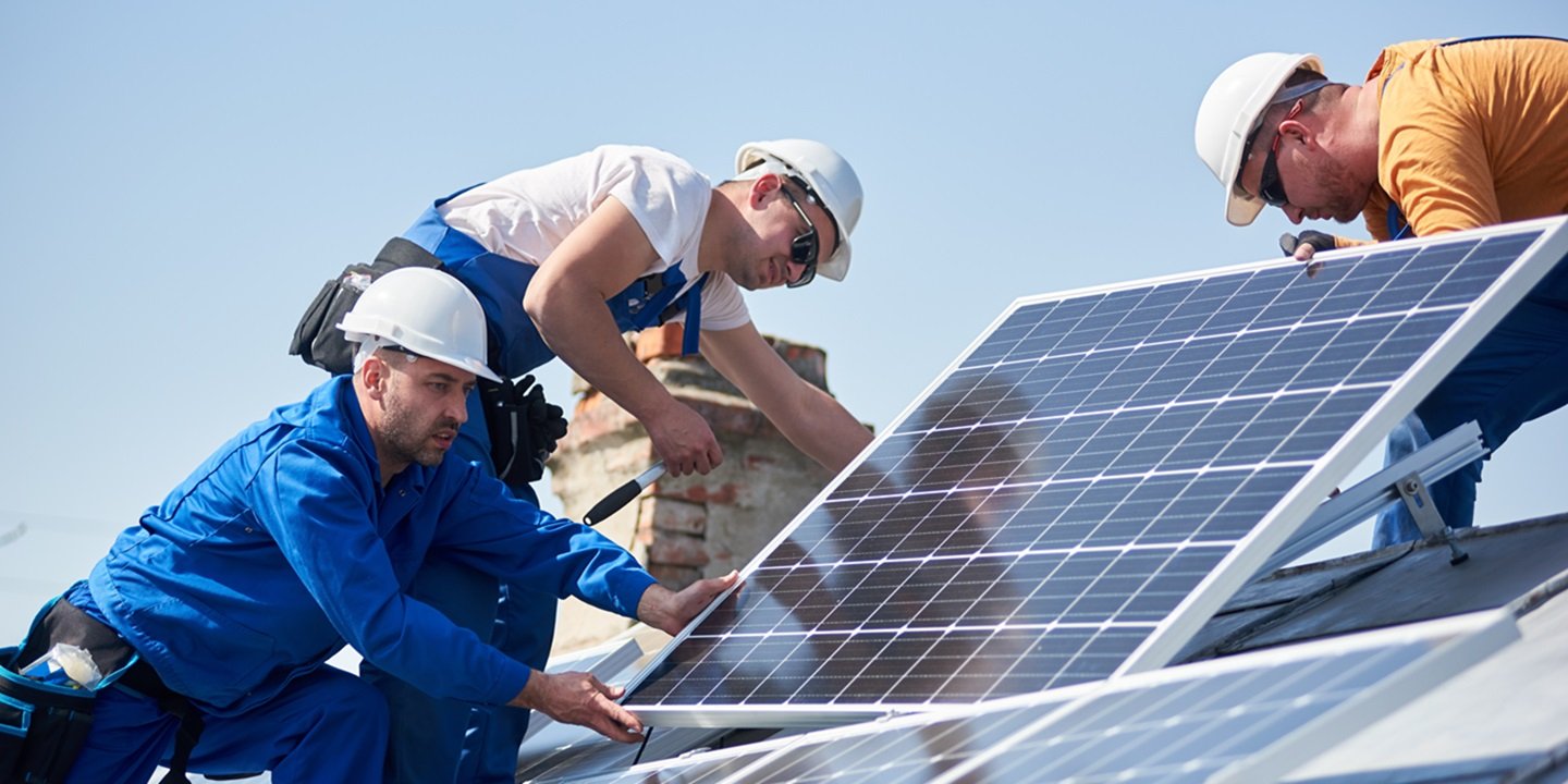 installing solar men working