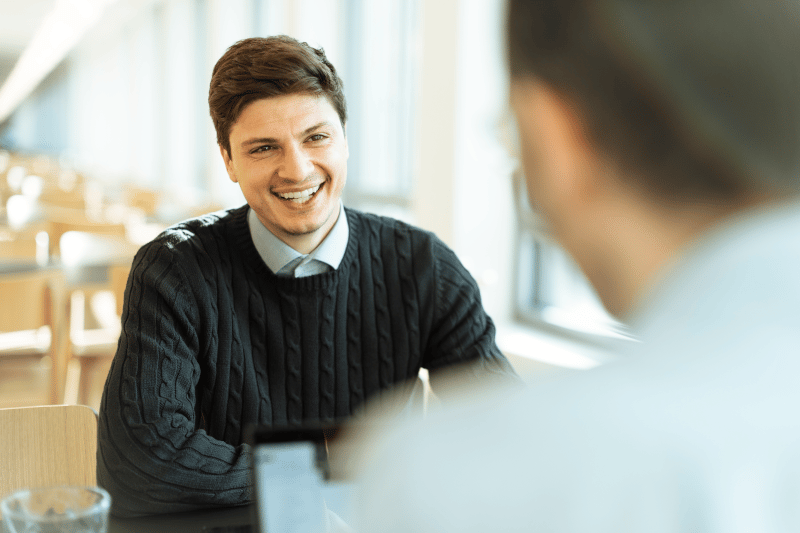 Two people in a face-to-face discussion