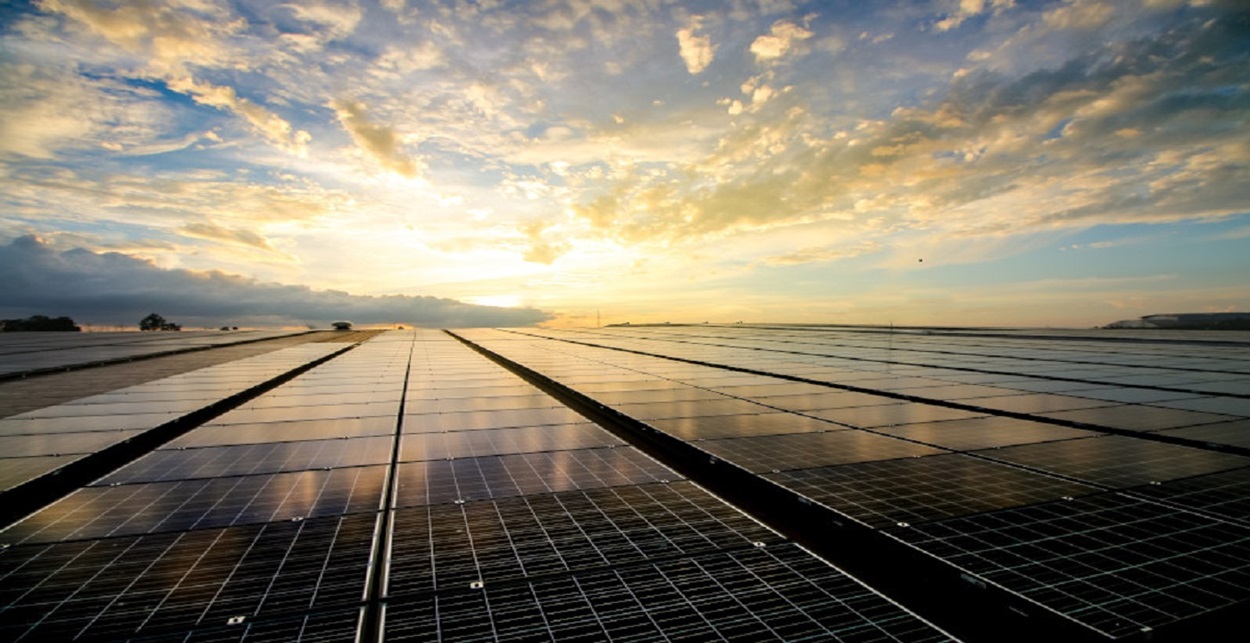 Large installation of solar batteries and sunset