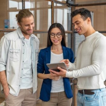 three people with tablet