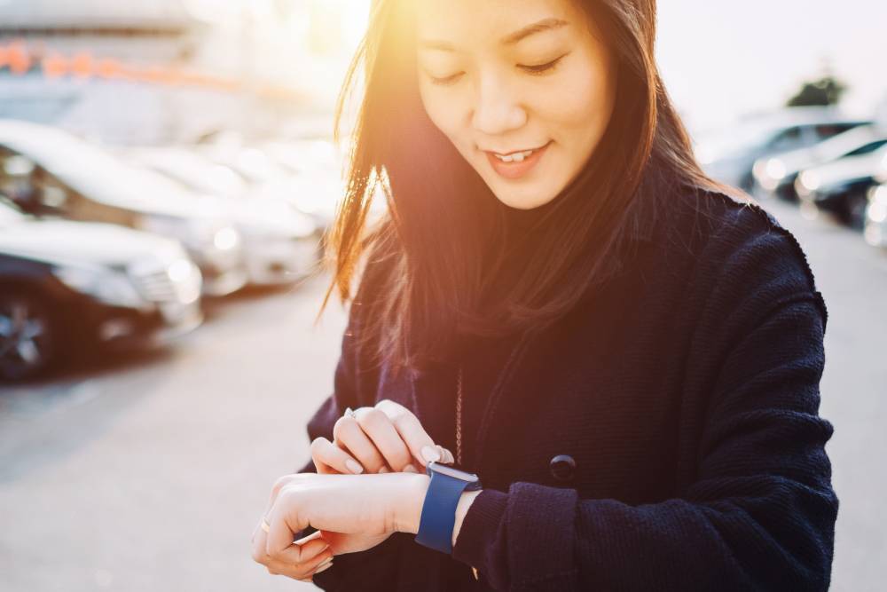 Woman looking at her watch