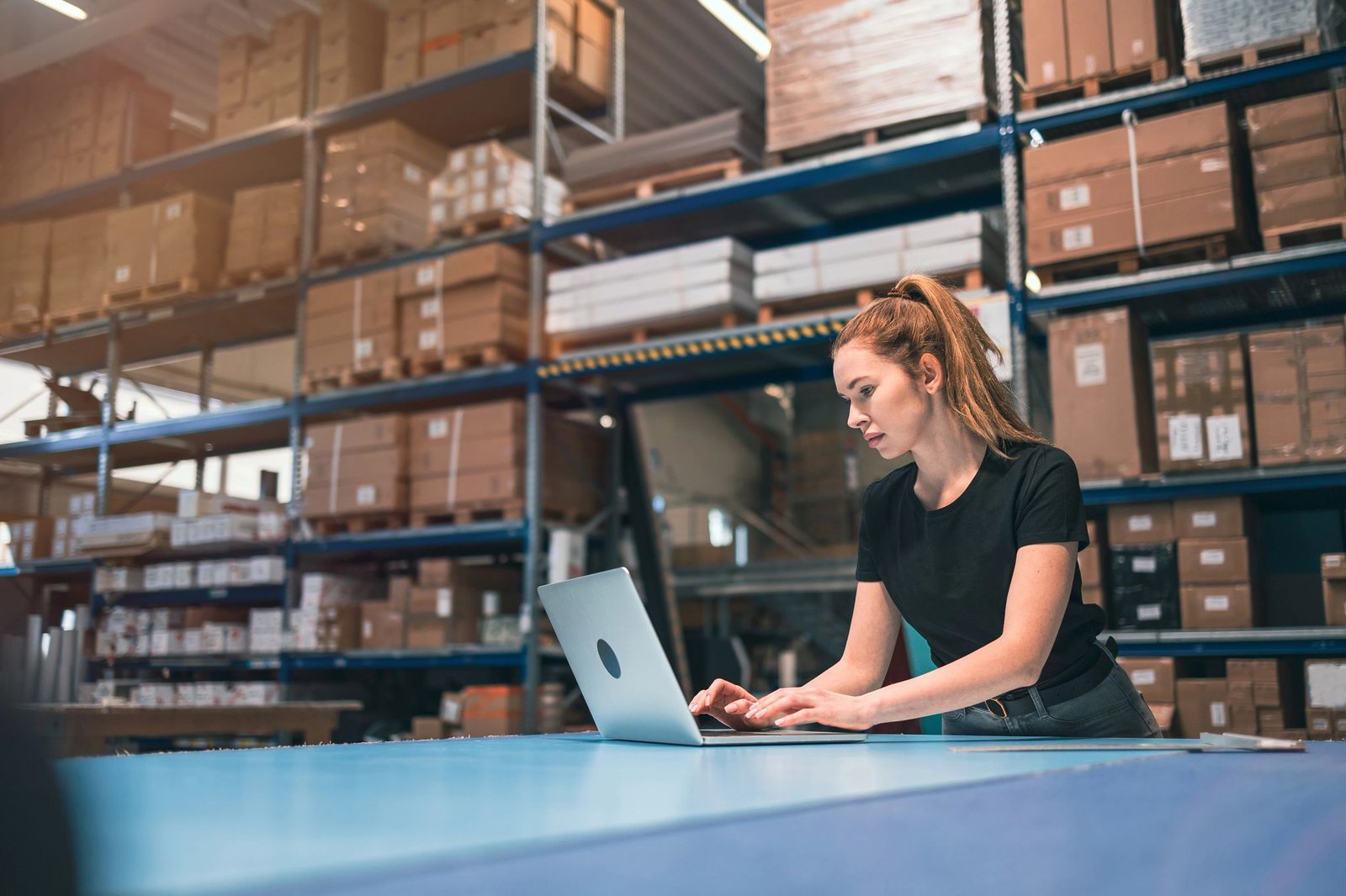Woman in warehouse shipping