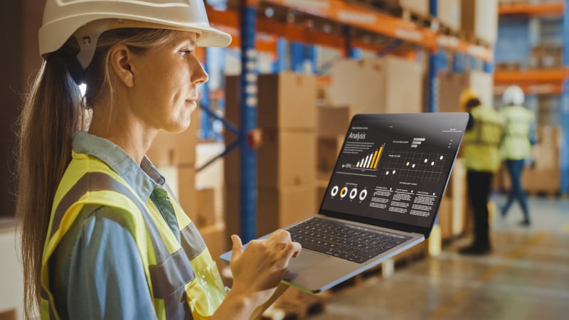 Woman in warehouse providing analysis