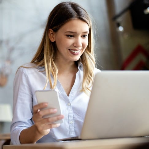 Girl smiling using devices Girl smiling using devices