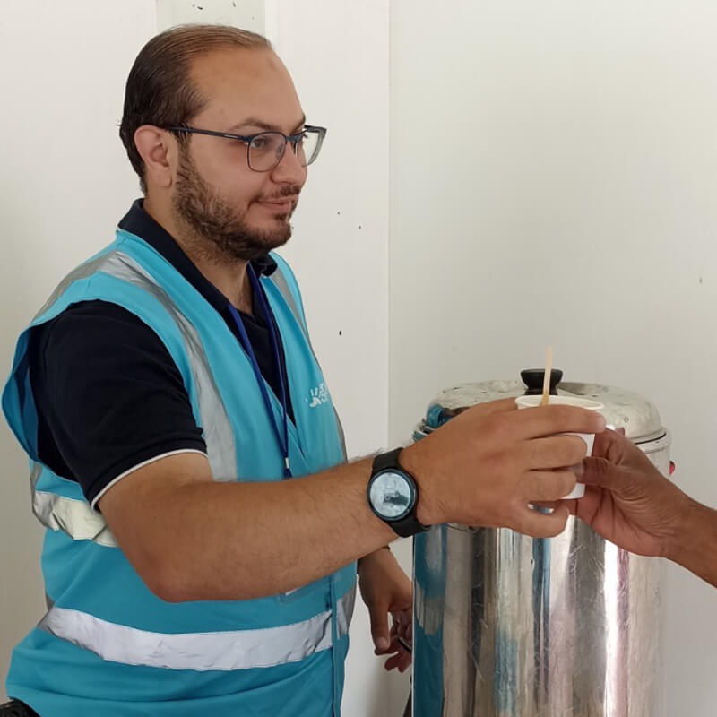 Man sharing a coffee with another person