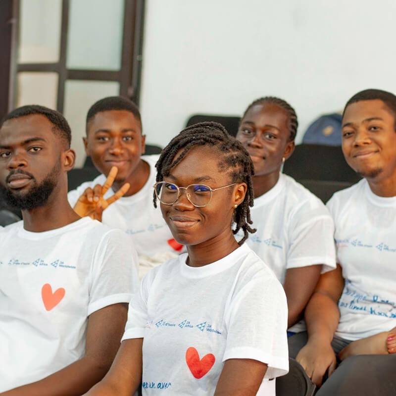 students in classroom smiling