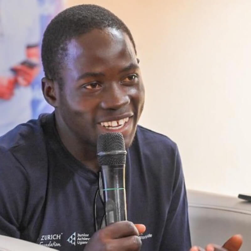 smiling man talking into a microphone