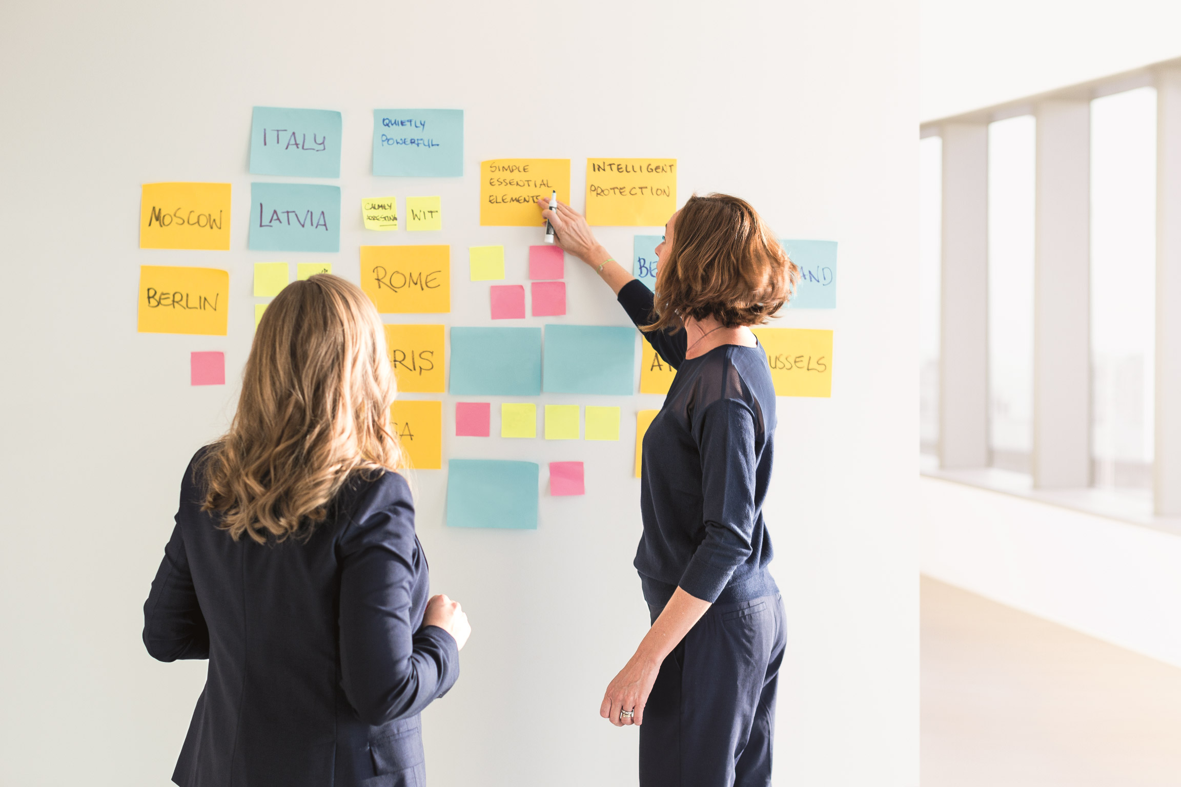 Two women with post it notes