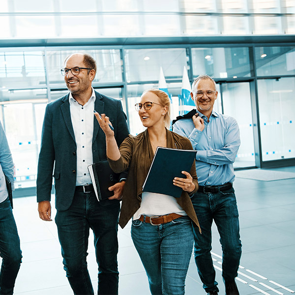 people walking together in an office